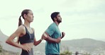 Sports, mountain and couple running on a trail for a workout or training for race, marathon or competition. Fitness, nature and athlete runners or friends doing an outdoor cardio exercise together.