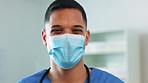 Doctor, man and face mask for healthcare safety, covid or protection from virus at the hospital. Portrait of happy male medical professional with smile covering mouth for sick prevention at clinic