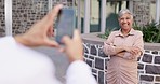 Phone, photography and arms crossed by senior woman leader smile for photo outside of office building. Smartphone, photographer and happy indian mature lady proud while posing for profile picture