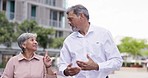 Business, woman and man walking, outdoor and discussion for new project, explain and share ideas. Male employee, happy female worker and partners outside, conversation and planning for collaboration