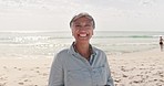 Happy, face and elderly woman at a beach for travel, vacation and summer holiday outdoors. Portrait, smile and senior mexican lady enjoying travel, trip and ocean holiday in Florida, excited and free