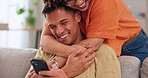 Love, hug diversity, happy couple on sofa with phone, happiness and marriage in apartment. Smile, man and woman embrace on couch in living room, romance and quality time for bonding together in home.