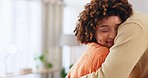 Hug, house and a couple embracing with a smile, comfort and love in the living room. Happiness, care and a man and woman hugging for affection, missing and caring together in the lounge of a home