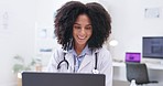 Smile, woman and doctor at laptop in clinic, planning research and reading online report. Face, happy female healthcare employee and working at computer, medical analysis and telehealth in hospital