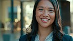 Happy, smile and face of a businesswoman in the city with a positive, good and confident mindset. Success, happiness and portrait of a professional female employee standing with confidence in town.