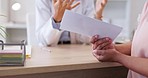 Woman, doctor and hands with sick note for patient diagnosis, illness or prescription on desk at clinic. Hand of female medical expert giving doctors certificate for healthcare visit or consultation