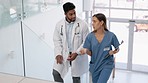 Healthcare, talking and doctors walking on stairs with advice, conversation and hospital training. Nursing, steps and a male and female nurse speaking about clinic agenda, schedule and surgery