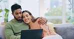 Hug, love and couple on a couch, laptop and conversation at home, living room and conversation. Partners, man and woman on a sofa, pc or technology in lounge, streaming movies or films with happiness