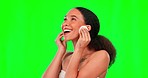 Cotton pad, green screen and face of woman for facial care, spa treatment and wellness in studio. Dermatology, skincare and happy girl on chromakey with pads for makeup removal, beauty and cosmetics