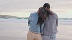 Couple, holding hands and walking at the beach during sunset, talking and bonding. Laughing, happy and back of a man and woman with affection and conversation on a walk at the ocean together