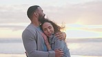 Young couple, hug and beach at sunset with love, happiness or romance with smile, nature and care. Man, woman and embrace with happiness, lens flare and outdoor for vacation, holiday and adventure