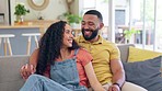 Relax, speaking and happy couple on a sofa enjoying conversation, relationship and bond in their home. Love, embrace and man resting with woman on couch, smile and laughing, romantic and talking