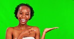 Green screen, beauty and face of black woman point for promotion, advertising and product in studio. Skincare mockup, chromakey and portrait of girl showing cosmetics, natural makeup and treatment