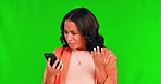 Green screen, angry and young woman on a phone call or shrugging shoulders or upset and annoyed in a studio background. Employee, confused and frustrated female model or problem with mobile device