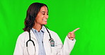 Healthcare, pointing and a doctor woman on a green screen background to recommend an insurance product. Medical, presentation and hand gesture with a young female medicine professional on chromakey