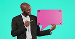 Pointing, portrait of man with speech bubble and with paper against a blue background. Marketing or advertising, 
sign and black male person with poster for announcement or news in studio backdrop