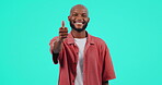 Portrait, thumbs up and motivation with a black man in studio on a blue background as a winner. Smile, hand or thank you and a happy male person with a gesture or emoji of yes in agreement of success