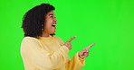 Happy woman, pointing finger and green screen for advertising space, announcement or promotion. African female person, laughing on studio background with hands for mockup, information or notification