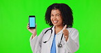 Mockup, phone and woman doctor, thumbs up isolated on green screen background for healthcare subscribe or like sign. Studio, blue space and ok hand of african medical person on mobile tracking marker