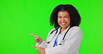 Happy woman, doctor and pointing on green screen for healthcare advertising against a studio background. Portrait of female person or medical professional showing advertisement in marketing on mockup