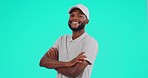 Face, smile and black man with arms crossed, carefree and confident guy on blue studio background. Portrait, male person or Nigerian model with casual outfit, happy and aesthetic with joy or cheerful