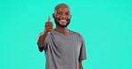 Face, smile and black man with thumbs up in studio isolated on a blue background mockup space. Portrait, like hand gesture and African male person with emoji for success, review or thank you for vote