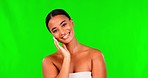 Green screen, happy woman and touch face for beauty, aesthetic glow and dermatology on studio background. Portrait of female model feeling soft skincare, self love and shine of natural facial results