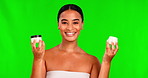 Portrait, skincare and lotion with a black woman on a green screen background in studio for beauty. Facial, cosmetics and cream with a happy young female model indoor to apply antiaging treatment