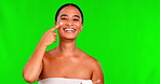 Portrait, skincare and cream with a black woman on a green screen background in studio for beauty. Facial, cosmetics and lotion with a happy young female model indoor to apply antiaging treatment