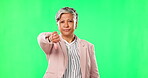 Thumbs down, woman and hand sign on green screen for bad review, poor service or voting. Portrait of senior business person on studio background shaking head for fail, negative feedback or emoji icon