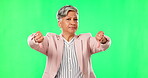 Woman, thumbs down and hand sign on green screen for a bad review, poor service or vote. Portrait of senior business person on a studio background with fail or negative feedback, icon or emoji