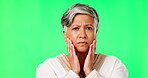 Woman, portrait and confused with green studio background with worry and upset about information. Mature female, face and sorry with fear about news or gossip with hands and thinking with confusion.