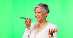 Phone call, voice chat and woman on green screen in studio isolated on a background mockup. Cellphone, speech and funny female person laughing at comedy, senior meme or conversation, talking or joke.