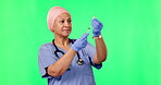 Needle, green screen and woman doctor isolated on a studio background for medical service, vaccine or healthcare. Medicine, syringe and healthcare surgeon, muslim person or nurse in safety and mockup