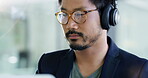 Music headphones, business man and lens flare in office working on project. Radio, listening and professional Asian person streaming audio, podcast or sound while reading, serious or focus on project