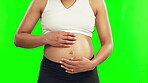Pregnant, hands on stomach and a woman on a green screen with care, hope and love. Closeup of female person touch or rub baby belly for pregnancy, health and wellness or new life on studio background