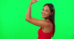 Woman, power and champion, flexing on green screen with muscle and strong person isolated on studio background. Portrait, smile and challenge, winner emoji and female  model, biceps and mockup space