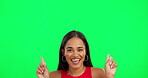 Happy woman, dancing and pointing on green screen for advertising against a studio background. Portrait of excited female person in dance for advertisement, sale discount or notification on mockup