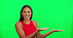 Happy woman, hands and advertising or presentation on green screen against a studio background. Portrait of female person with smile showing advertisement for marketing or branding on mockup space