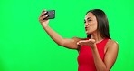 Woman, green screen and selfie with kiss, smile and mockup space with post on social network. Influencer girl, model or young student with photography, peace sign and happy for promo with mobile app