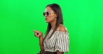 Woman, fashion and talking in style on green screen for shopping against a studio background. Happy female person or stylish model with sunglasses enjoying conversation, talk or discussion on mockup