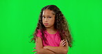 Green screen, face and girl with arms crossed, no and shaking head against a studio background. Portrait, female child and kid with disagreement, review and refuse with emoji, frustrated and anger