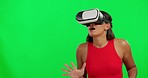 Woman, green screen and virtual reality glasses in studio for surprise, metaverse gaming or moving hand for mockup. Girl, model and cyber gamer with ar technology for 3d video, user experience or wow