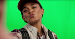 Green screen, selfie and woman on video call or social media for travel vlog isolated in a studio background. Online, pout and happy influencer on an adventure to explore on holiday or living stream