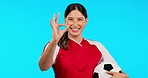 Hand, perfect and face of happy woman with soccer ball in studio for training, vote or thank you on blue background. Okay, emoji and portrait of female football player smile for sports or exercise