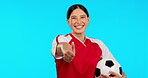 Sports, thumbs up and soccer with face of woman in studio for winner, motivation or support. Football, success and mockup with portrait of female athlete on blue background for thank you and training