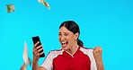 Winner woman, money rain and sport with phone, happy and online betting with gambling success by blue background. Young girl, smartphone and cash in air with esports, web contest and excited face