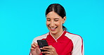 Funny, phone and girl reading in studio with meme, social media or smile on face for sports blog, joke on blue background. Mockup, athlete and laughing at internet, online or comedy on mobile app