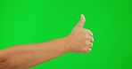 Thumbs up, hand and like with success, green screen and agreement against a studio background. Closeup, winning and emoji with yes sign, symbol and approve with achievement, good job and thank you