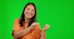 Green screen, face and happy Asian woman point at promotion news, retail commercial space or sales discount. Chroma key portrait, presentation gesture or Japanese person pointing on studio background